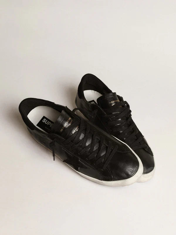 Super-Star in black nappa leather with a suede black star and heel tab