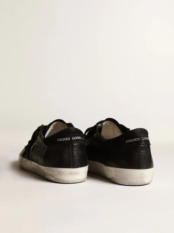 Super-Star in black nappa leather with a suede black star and heel tab