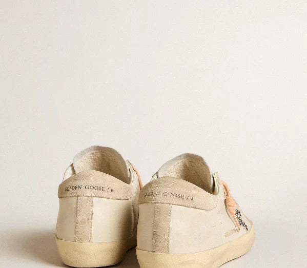 Super-Star LTD in leather with a beige suede star and Swarovski studs